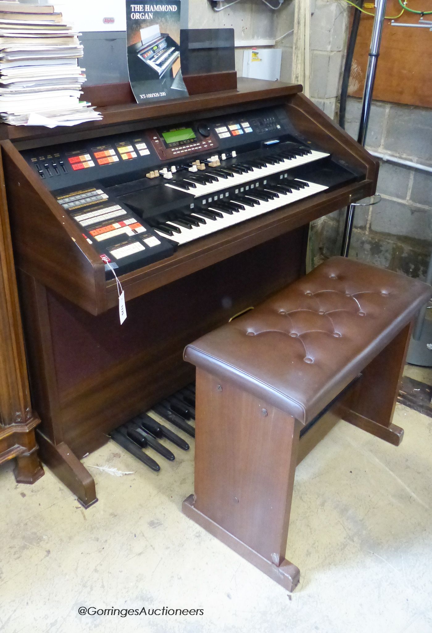 A Hammond organ, XT-100/XH-200 with stool and a quantity of music books. W-125cm.